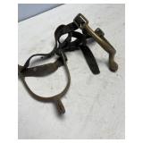 pair of brass equestrian spurs with leather