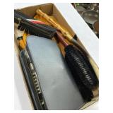 Shoehorn, shoe polishing brushes, and grooming