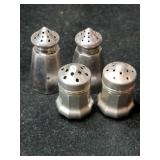 Silver salt and pepper shakers marked Sterling.