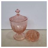 Pink depression glass lidded jar and flower frog