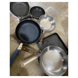 Variety of frying pans, and a cooling rack