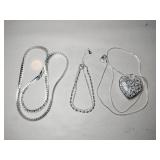 2 silver tone necklaces and  1  bracelet