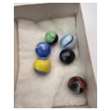 6 old marbles