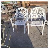 2 white metal patio chairs
