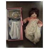 Two porcelain dolls, one in original box