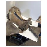 McClellan US cavalry saddle damaged, leather, and