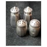 Silver salt and pepper shakers marked Sterling.