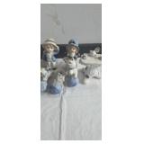 Blue and white playful kitten figurines, boy and