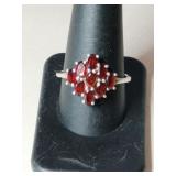 Silver redstone flower ring marked 925 size 10.