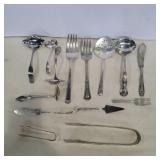 Assorted serving flatware and tongs