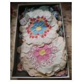 Box of vintage fabric quilting pieces.