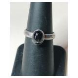 Silver blue stone marked 925 size 6.   .105oz