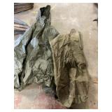 Military poncho and duffel bag
