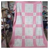 Hand made pink and white quilt with some