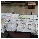 Assorted embroidery and printed table cloths,