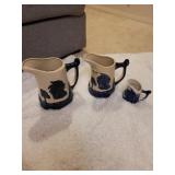 3 blue Indian head pitchers