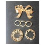 4 gold tone brooches  bow