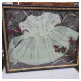 Framed baby dress in shadow box 25.5in x 20.5in