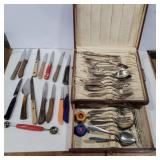 Assorted flatware and knives in wooden case