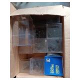 Two boxes with plastic containers that are full