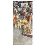 Assortment of giraffe figurines 10-13in various
