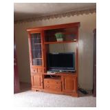 Large entertainment center includes TV and