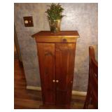 Pie safe wood with artificial flowers on top