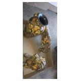 Porcelain lion sculptures, in decorative vase