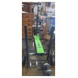 Competitor's weight bench with weights, dumbell