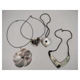 4  carved necklaces