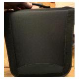 Brand new zippered cd/dvd/video game disc holder.