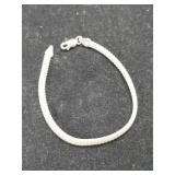 Silver rope style bracelet marked 925.     .190oz