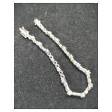 Silver X&O tennis bracelet marked 925.    .320oz