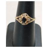 10K bluestone ring marked 10K size 6.5.    .060oz