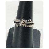 Silver bow  ring marked 925 size 6.  .090oz
