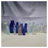 16 glass bottles 3in-6in various colors