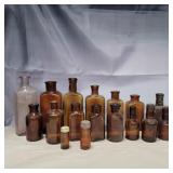 17 brown glass bottles various sizes