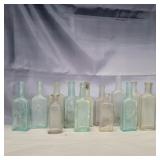 15 glass bottles 6in clear and blue glass
