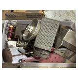 Mix of kitchen and baking tools, graters, juicer,