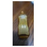 item is a vintage amber glass miniature bottle,