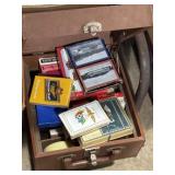 Latch Case full of playing cards and coasters,