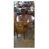 Round claw footed pedestal dining table with 4
