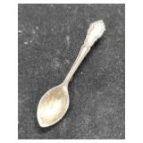 Silver spoon brooch marked Sterling.     .135oz