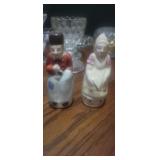 This item is a vintage porcelain salt and pepper