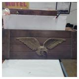 Brass eagle mounted on wood 37in across 14in tall