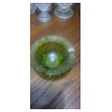 This item is a vintage green glass ashtray,