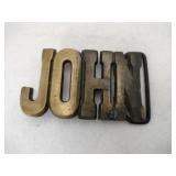 Brass. 'JOHN'  belt buckle
