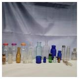 24 small glass bottles 1in - 5in various colors