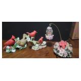 Cardinals figurines and a music box plays