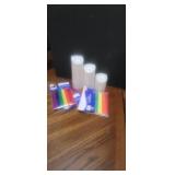 Battery candles and rainbow sashes, bandana